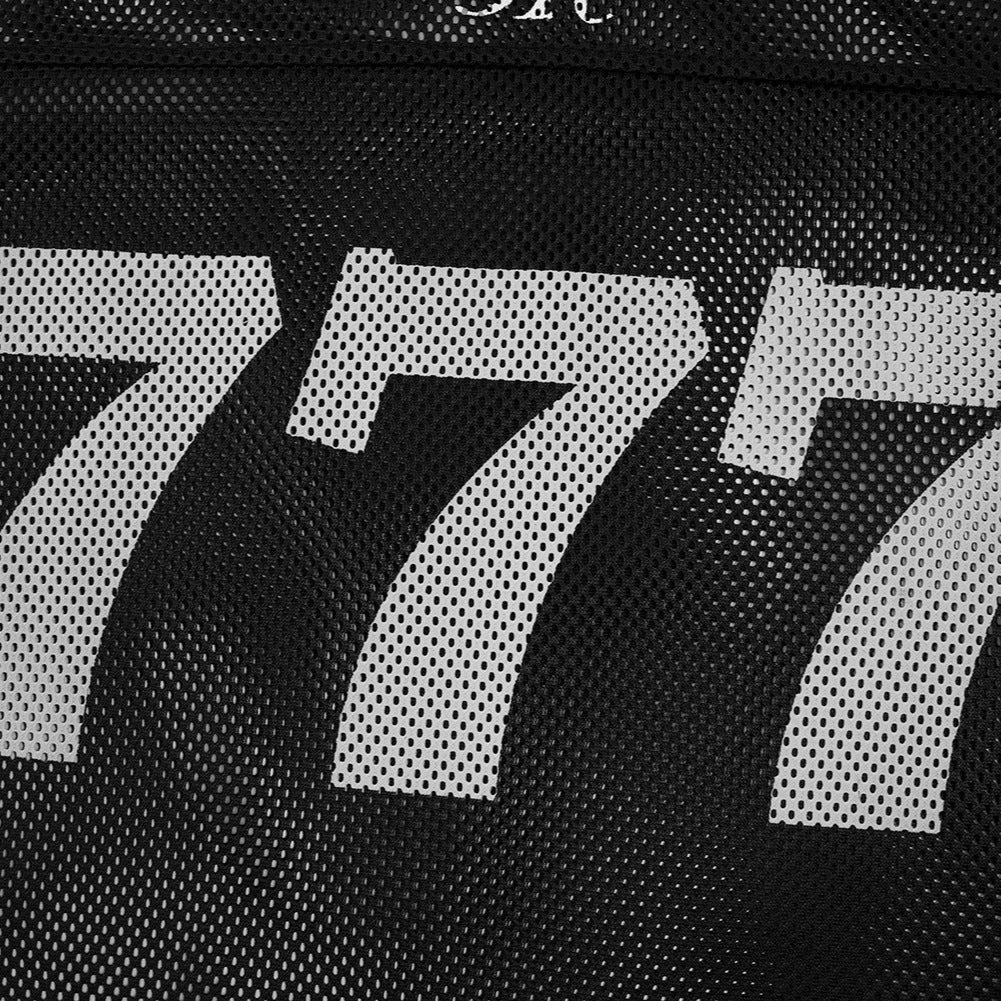 Close-up of a textured surface with the number '777' printed on it.