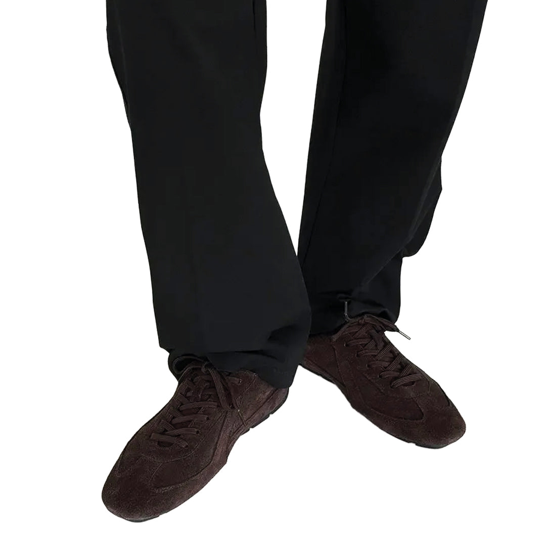 Dark pants and brown shoes on a white background