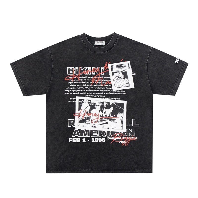 Black t-shirt with graphic designs and text on a white background