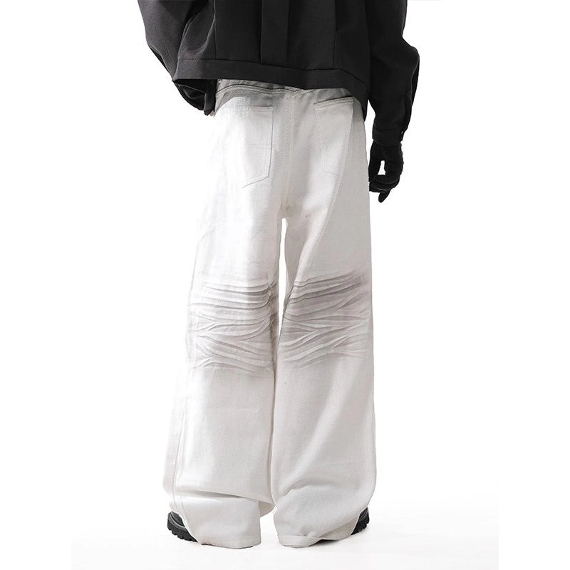 White wide-leg pants worn by a person on a white background